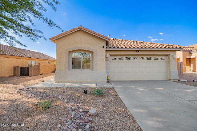 217 E Creosote Draw Rd, Vail, AZ 85641 - mediterranean / spanish home with a garage, a tile roof, and stucco siding
