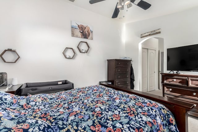 217 E Creosote Draw Rd, Vail, AZ 85641 - bedroom with arched walkways, carpet, a ceiling fan, and a closet