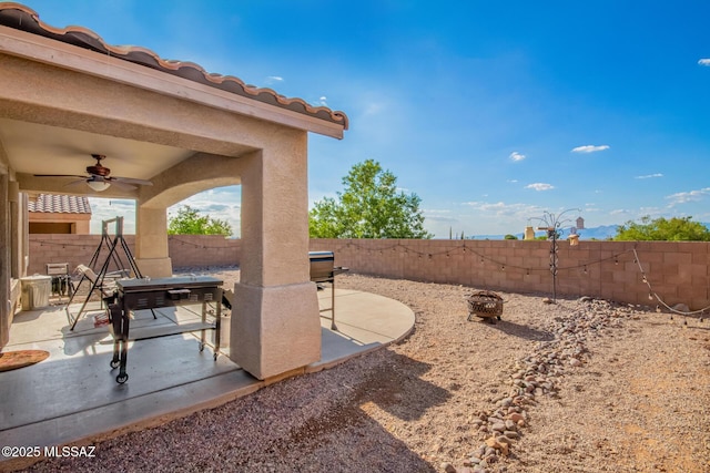 217 E Creosote Draw Rd, Vail, AZ 85641 - fenced backyard featuring a patio and ceiling fan