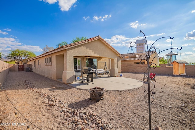 217 E Creosote Draw Rd, Vail, AZ 85641 - back of house featuring a patio, stucco siding, a tile roof, an outdoor fire pit, and a fenced backyard