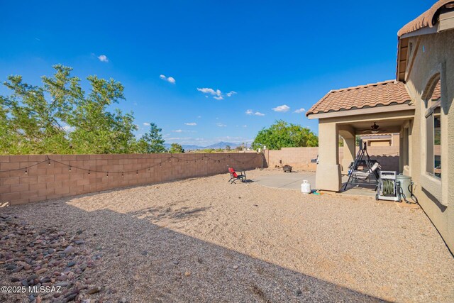 217 E Creosote Draw Rd, Vail, AZ 85641 - fenced backyard with a patio area and a mountain view
