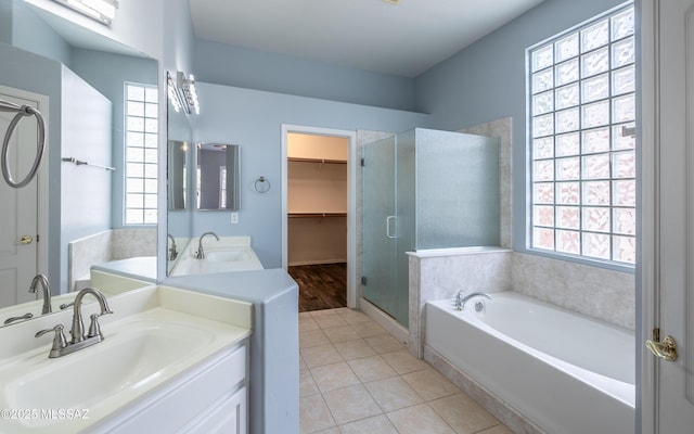 8892 N Silver Moon Way, Tucson, AZ 85743 - full bathroom with a stall shower, healthy amount of natural light, a garden tub, and tile patterned floors