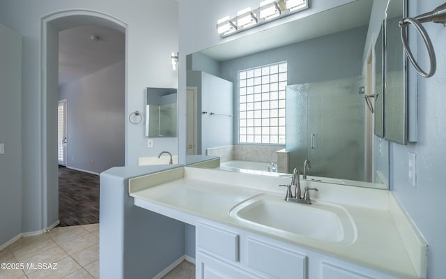 8892 N Silver Moon Way, Tucson, AZ 85743 - bathroom with a shower stall, a bath, vanity, tile patterned flooring, and baseboards