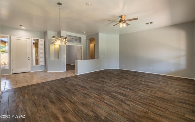 8892 N Silver Moon Way, Tucson, AZ 85743 - empty room featuring wood finished floors, ceiling fan, and baseboards