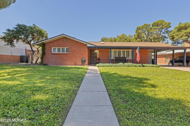 3357 N Christmas Ave, Tucson, AZ 85716 - single story home featuring central AC, brick siding, and an attached carport