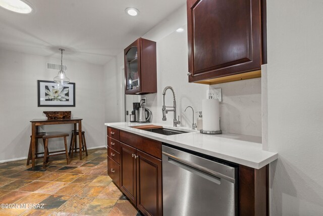 3357 N Christmas Ave, Tucson, AZ 85716 - kitchen with dishwasher, a sink, stone finish flooring, light countertops, and pendant lighting