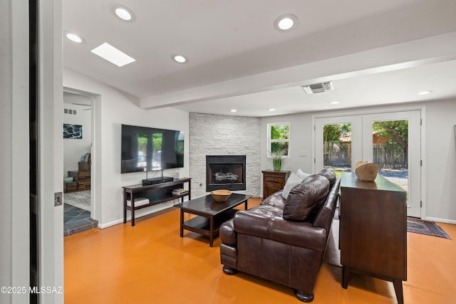 3357 N Christmas Ave, Tucson, AZ 85716 - living room featuring recessed lighting, a fireplace, baseboards, and french doors