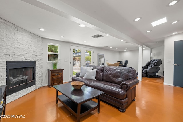 3357 N Christmas Ave, Tucson, AZ 85716 - living room featuring recessed lighting, concrete flooring, and a fireplace