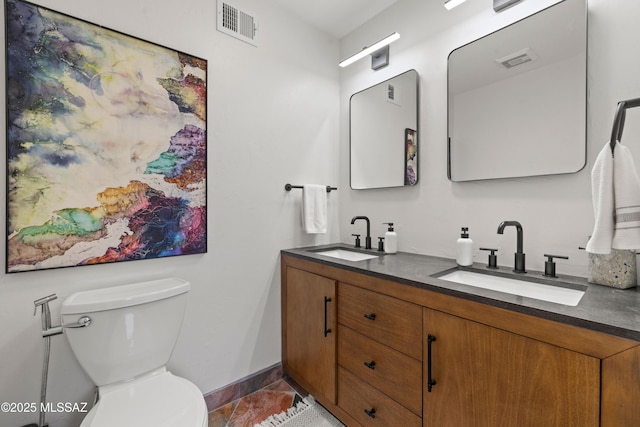 3357 N Christmas Ave, Tucson, AZ 85716 - bathroom with double vanity, baseboards, tile patterned floors, and toilet