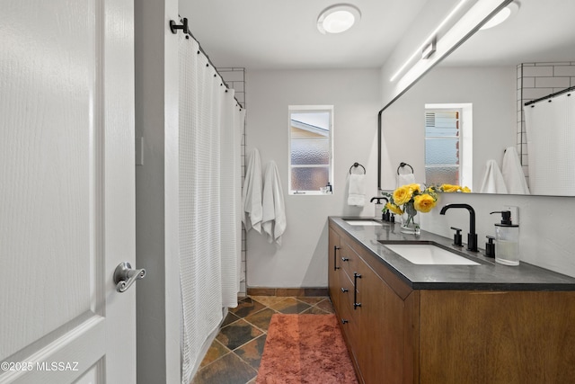 3357 N Christmas Ave, Tucson, AZ 85716 - bathroom with double vanity, baseboards, tile patterned flooring, and curtained shower