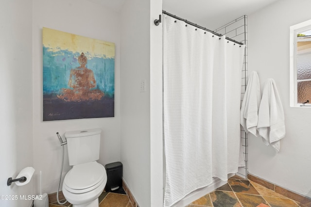 3357 N Christmas Ave, Tucson, AZ 85716 - full bathroom with toilet, curtained shower, baseboards, and stone finish flooring