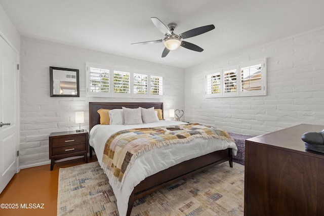 3357 N Christmas Ave, Tucson, AZ 85716 - bedroom with brick wall and a ceiling fan