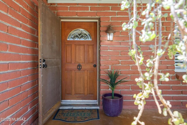 3357 N Christmas Ave, Tucson, AZ 85716 - doorway to property featuring brick siding