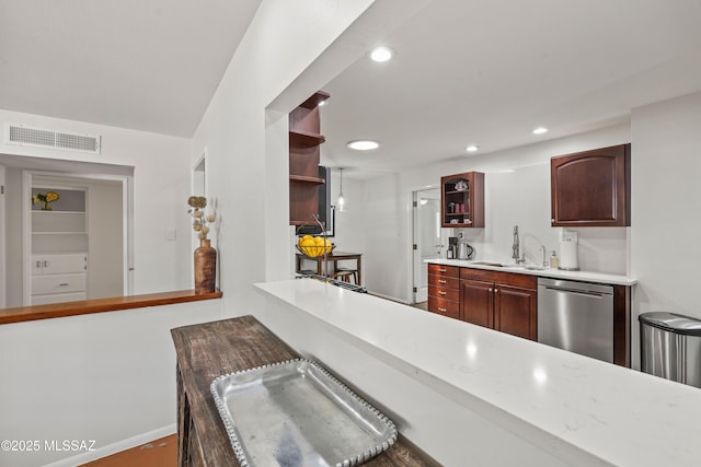3357 N Christmas Ave, Tucson, AZ 85716 - kitchen with open shelves, stainless steel dishwasher, light countertops, a sink, and baseboards