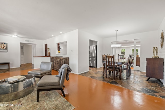 3357 N Christmas Ave, Tucson, AZ 85716 - living area featuring baseboards, stone tile flooring, and recessed lighting