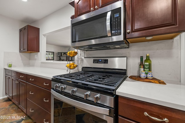 3357 N Christmas Ave, Tucson, AZ 85716 - kitchen with stainless steel appliances, light countertops, and decorative backsplash