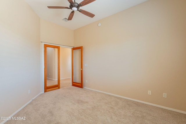 3259 E Corte Doce Palomas, Tucson, AZ 85718 - unfurnished bedroom with carpet flooring, baseboards, ceiling fan, and high vaulted ceiling