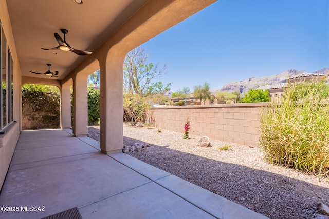 3259 E Corte Doce Palomas, Tucson, AZ 85718 - fenced backyard with a mountain view, ceiling fan, and a patio area