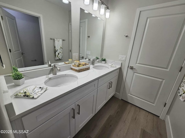 2020 E River Rd Unit 205, Tucson, AZ 85718 - bathroom featuring wood finished floors and double vanity