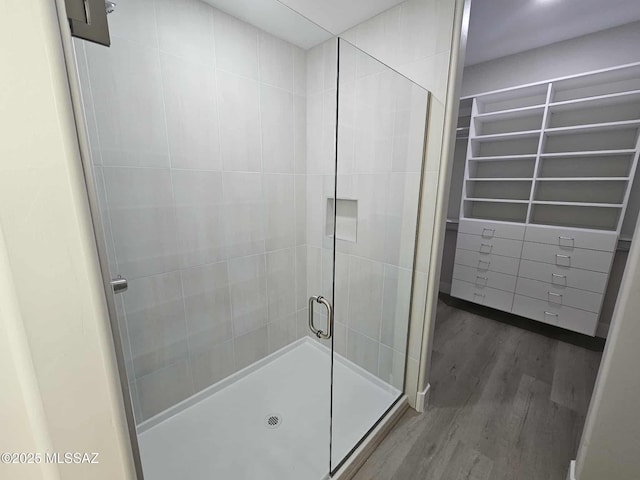 2020 E River Rd Unit 205, Tucson, AZ 85718 - full bathroom with a stall shower and wood finished floors