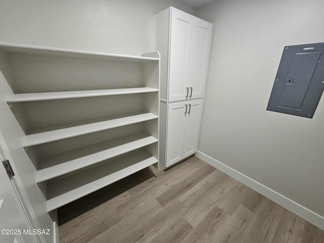 2020 E River Rd Unit 205, Tucson, AZ 85718 - walk in closet with electric panel and wood finished floors