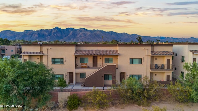 2020 E River Rd Unit 205, Tucson, AZ 85718 - property at dusk with a mountain view