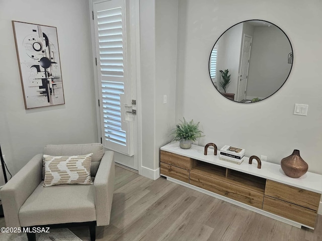 2020 E River Rd Unit 205, Tucson, AZ 85718 - living area with light wood-style flooring and baseboards