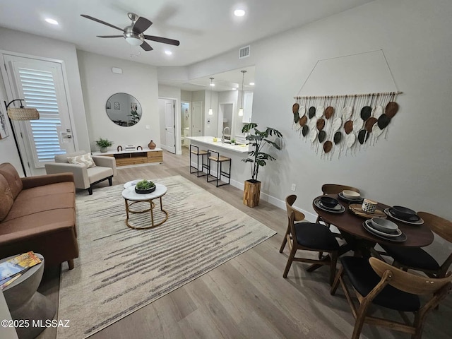 2020 E River Rd Unit 205, Tucson, AZ 85718 - living area with light wood-style floors, ceiling fan, recessed lighting, and baseboards