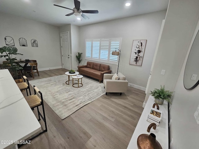 2020 E River Rd Unit 205, Tucson, AZ 85718 - living area with baseboards, light wood-type flooring, ceiling fan, and recessed lighting