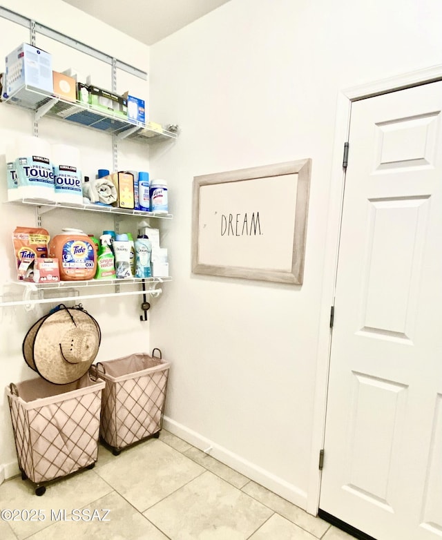9828 N Niobrara Way, Tucson, AZ 85742 - laundry room with baseboards and tile patterned flooring