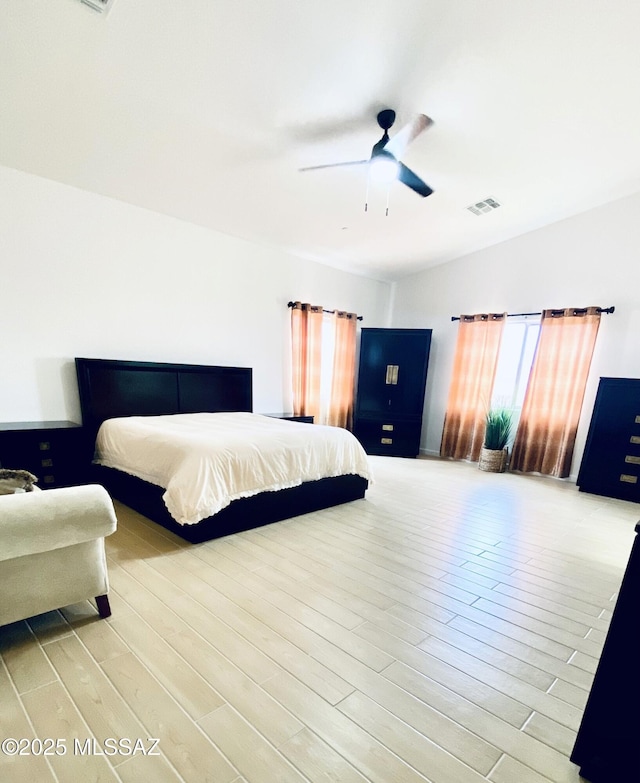 9828 N Niobrara Way, Tucson, AZ 85742 - bedroom featuring wood finished floors and a ceiling fan