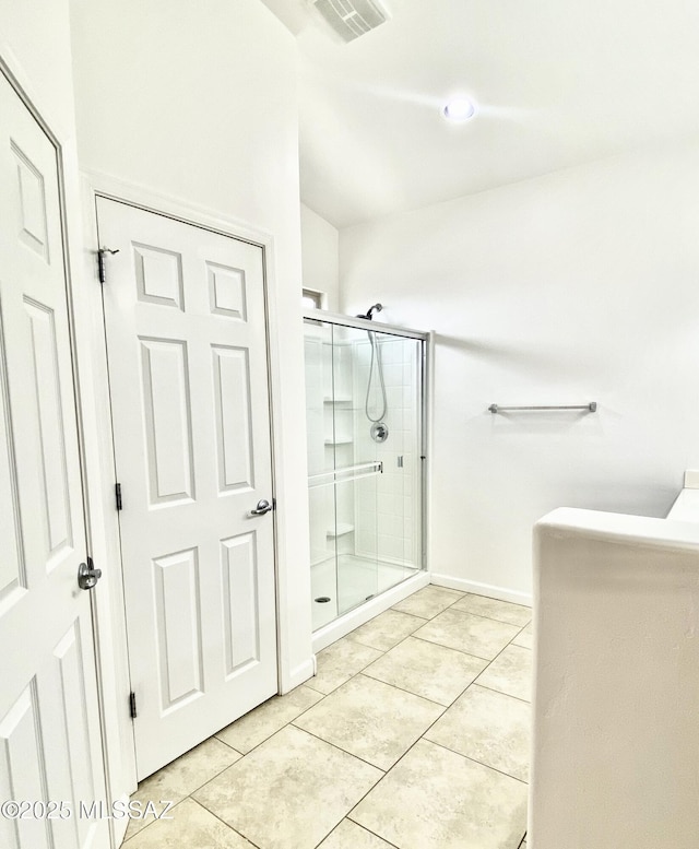9828 N Niobrara Way, Tucson, AZ 85742 - full bathroom featuring a stall shower, tile patterned flooring, and baseboards