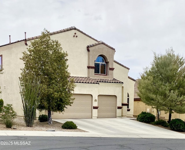 9828 N Niobrara Way, Tucson, AZ 85742 - mediterranean / spanish-style house with a tiled roof, an attached garage, stucco siding, and driveway