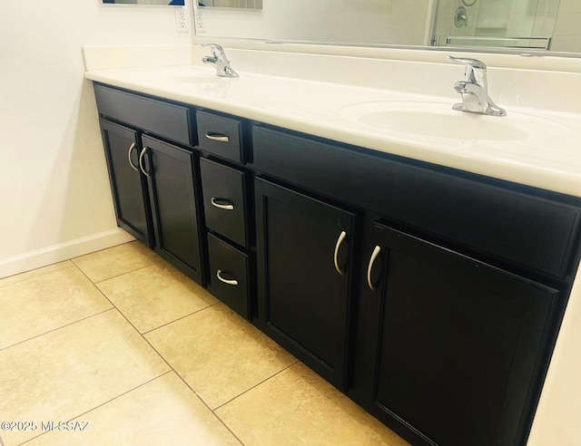 9828 N Niobrara Way, Tucson, AZ 85742 - full bath with double vanity, baseboards, and tile patterned flooring