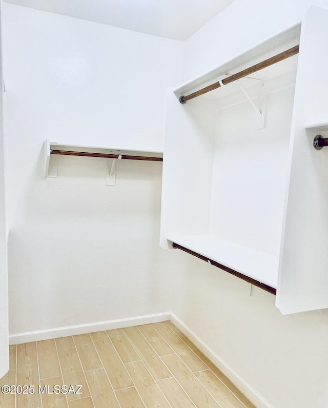 9828 N Niobrara Way, Tucson, AZ 85742 - walk in closet with wood finished floors