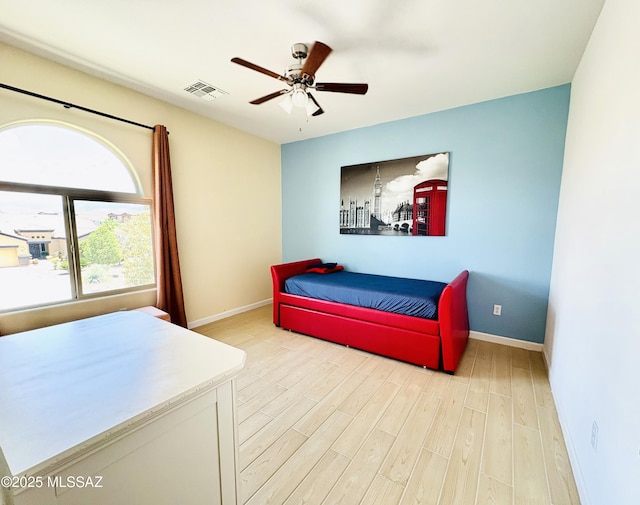 9828 N Niobrara Way, Tucson, AZ 85742 - bedroom with light wood-style floors, baseboards, and a ceiling fan