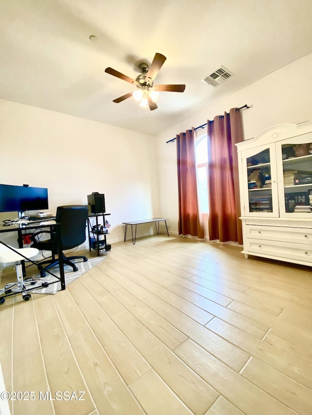 9828 N Niobrara Way, Tucson, AZ 85742 - office area with a ceiling fan and light wood-style floors