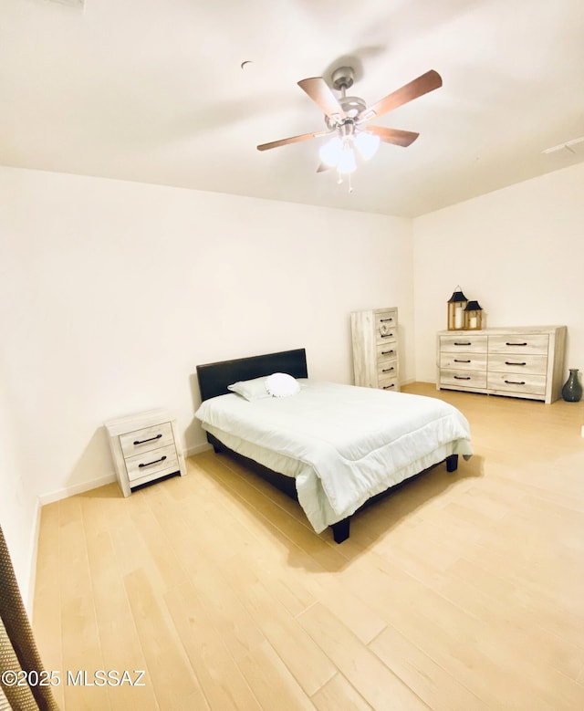 9828 N Niobrara Way, Tucson, AZ 85742 - bedroom with wood finished floors and a ceiling fan
