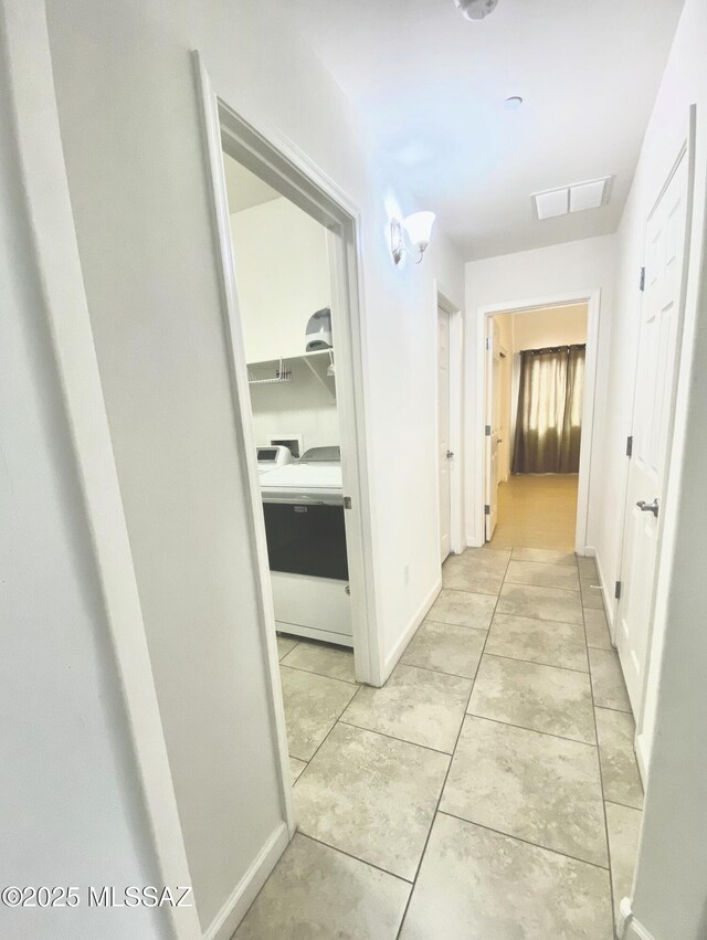 9828 N Niobrara Way, Tucson, AZ 85742 - hallway featuring light tile patterned flooring and baseboards