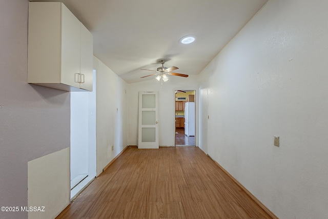 7821 N Jensen Dr, Tucson, AZ 85741 - spare room featuring ceiling fan, light wood-type flooring, and lofted ceiling