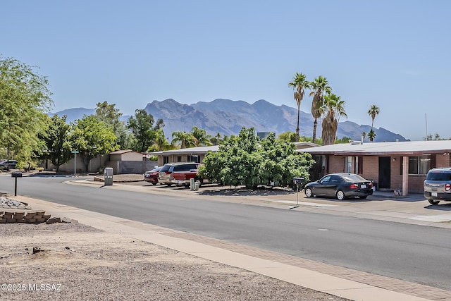 7821 N Jensen Dr, Tucson, AZ 85741 - view of asphalt street with a mountain view and sidewalks