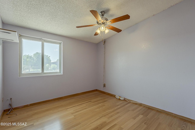 7821 N Jensen Dr, Tucson, AZ 85741 - unfurnished room with light wood-style flooring, a ceiling fan, and a textured ceiling