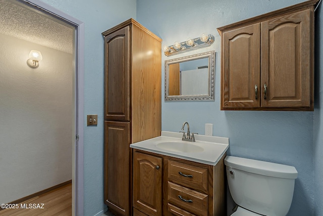7821 N Jensen Dr, Tucson, AZ 85741 - half bathroom featuring vanity and wood finished floors