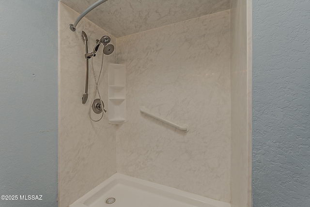 7821 N Jensen Dr, Tucson, AZ 85741 - bathroom with a shower and a textured wall