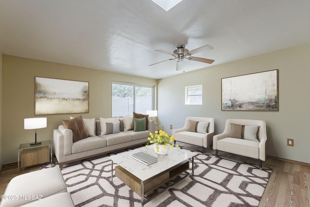 7821 N Jensen Dr, Tucson, AZ 85741 - living room featuring wood finished floors and ceiling fan