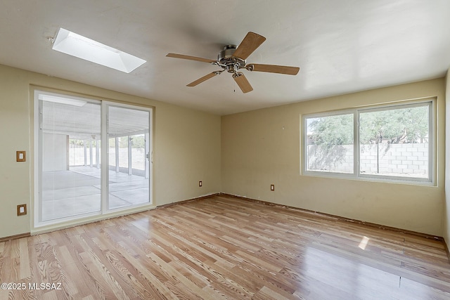7821 N Jensen Dr, Tucson, AZ 85741 - unfurnished room with plenty of natural light, light wood finished floors, and a ceiling fan