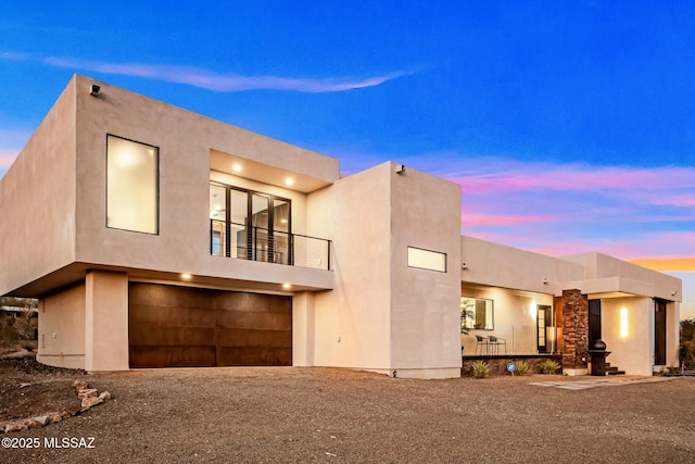 4939 E River Rd, Tucson, AZ 85718 - view of front facade with a balcony, stucco siding, and an attached garage