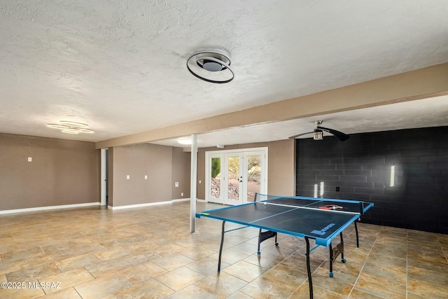 4939 E River Rd, Tucson, AZ 85718 - playroom featuring french doors, a ceiling fan, baseboards, and a textured ceiling
