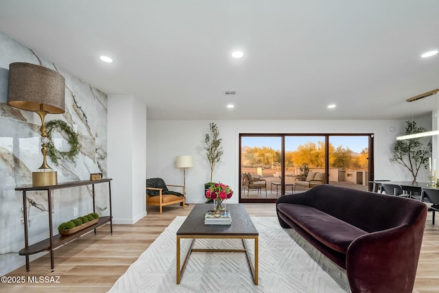 4939 E River Rd, Tucson, AZ 85718 - living room featuring light wood-style floors, recessed lighting, and baseboards