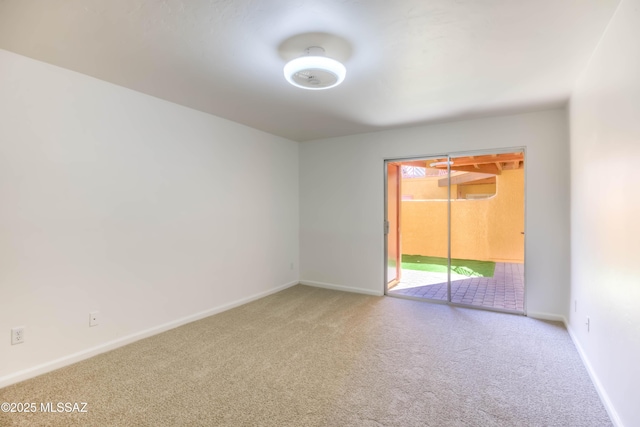 6255 N Camino Pimeria Alta Apt 81, Tucson, AZ 85718 - carpeted empty room with baseboards